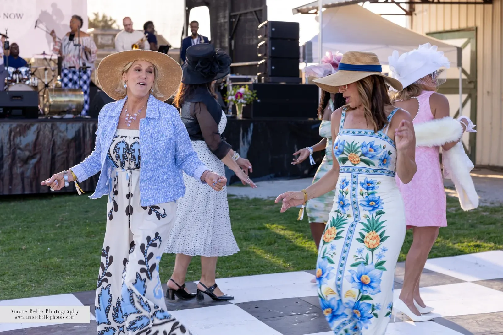Guests in Derby attire on the checkered dance floor