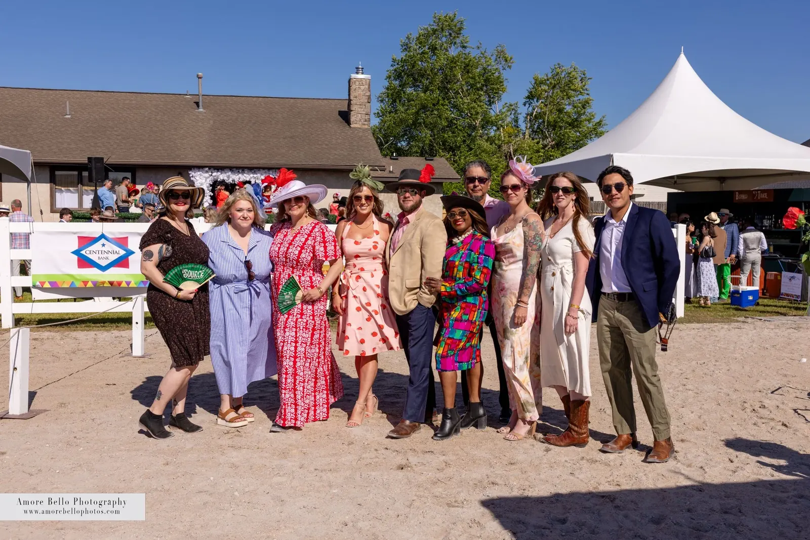A group in Derby attire on the track